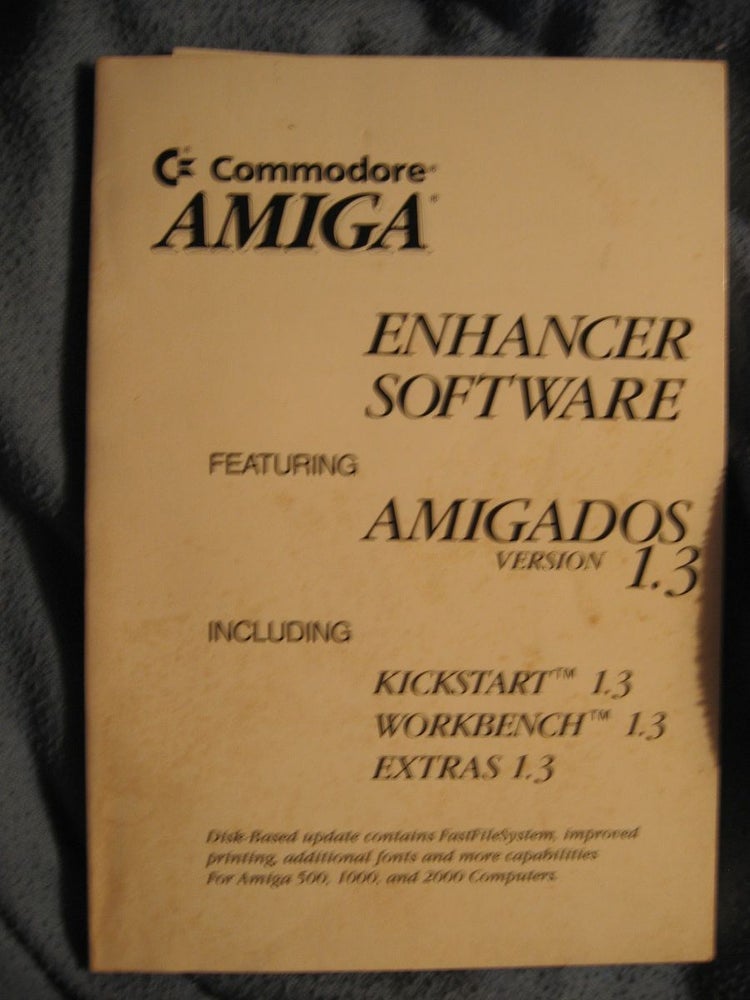 Item #R199 Enhancer Software featuring AmigaDOS version 1.3 including Kickstart 1.3; workbench 1.3; Extras 1.3 MANUAL ONLY NO DISKS. Commodore Amiga.